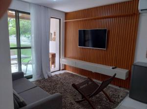 Televiisor ja/või meelelahutuskeskus majutusasutuses Apartamento Iloa 07-H