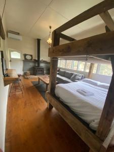 a bedroom with a bunk bed in a room at Wandi General in Wandiligong