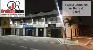 a building with a sign in front of it at Apartamento mobiliado com dois quartos para locação fixo e mensal in Fortaleza