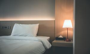 Wonju City Hotel HYEOKSIN客房内的一张或多张床位
