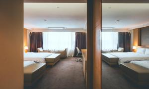 Postel nebo postele na pokoji v ubytování Wonju City Hotel HYEOKSIN + 37 fotografií
