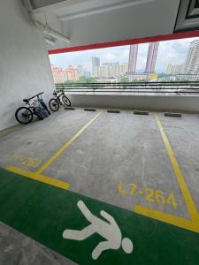a parking lot with bikes parked in a building at Studio Stay in Kuala Lumpur