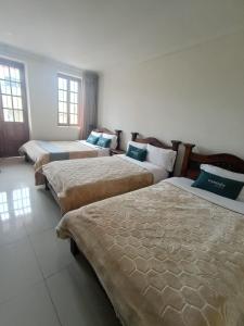 Postel nebo postele na pokoji v ubytování HOTEL El MONARCA