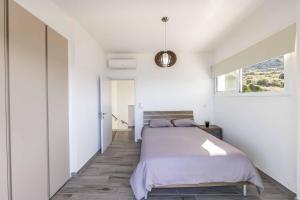 Postel nebo postele na pokoji v ubytování Pomos Seashore villa