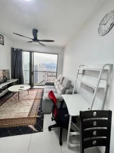 a living room with a couch and a bunk bed at Cozy kenwingston Platz KL 2-5 pax 2BR&2BR genting view parkin netflix 3802 in Kuala Lumpur