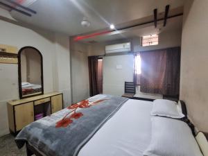 Voodi või voodid majutusasutuse Hotel Om Pushkar toas