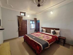 Voodi või voodid majutusasutuse Hotel Om Pushkar toas