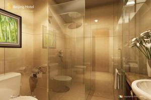 a bathroom with a shower and a toilet and a sink at Beijing Hotel Vinh - by BAY LUXURY in Ngô Xa +15 photos