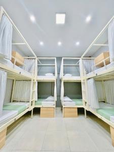Postel nebo postele na pokoji v ubytování Amy 2 Hostel Hue