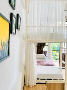 Postel nebo postele na pokoji v ubytování Amy 2 Hostel Hue