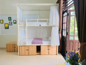 Postel nebo postele na pokoji v ubytování Amy 2 Hostel Hue