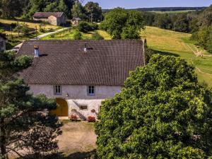 an aerial view of a white house with a brown roof at Chambre Rubis: Élégance et Confort en Pleine Nature - FR-1-589-723 in Le Clerjus