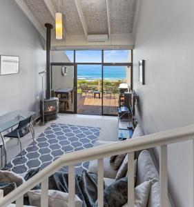 a living room with a view of the ocean at 13 Whitecrest Great Ocean Road Resort - Ocean Views in Wongarra