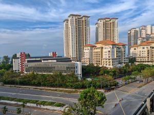 a view of a city with tall buildings and a road at Luxe Romance with Seaview & Bathtub - Jazz Suites by Ocean Luxe in Tanjong Tokong