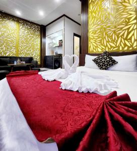 Postel nebo postele na pokoji v ubytování HA Hotel & Apartment