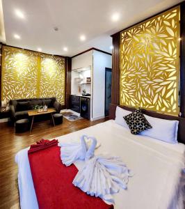 Postel nebo postele na pokoji v ubytování HA Hotel & Apartment
