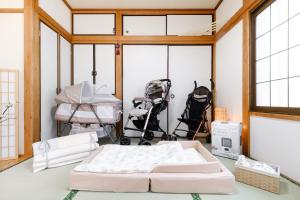 Postel nebo postele na pokoji v ubytování 東京芳华驿站