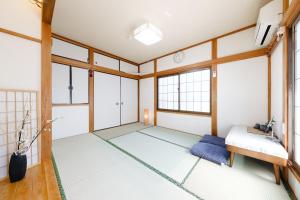 Postel nebo postele na pokoji v ubytování 東京芳华驿站