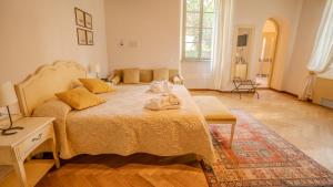 Postel nebo postele na pokoji v ubytování Relais Corte Cavalli