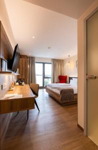 Postel nebo postele na pokoji v ubytování Weinzuhause Hotel-Restaurant-Vinothek