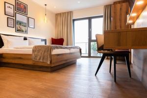 Postel nebo postele na pokoji v ubytování Weinzuhause Hotel-Restaurant-Vinothek