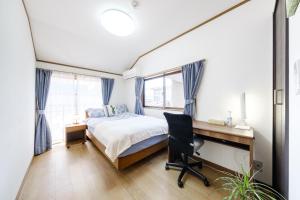 Postel nebo postele na pokoji v ubytování 東京芳华驿站
