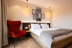 Postel nebo postele na pokoji v ubytování Weinzuhause Hotel-Restaurant-Vinothek