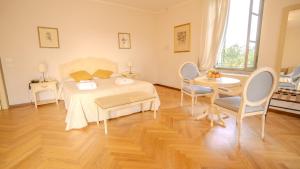 Postel nebo postele na pokoji v ubytování Relais Corte Cavalli