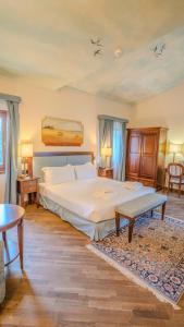 Postel nebo postele na pokoji v ubytování Relais Corte Cavalli