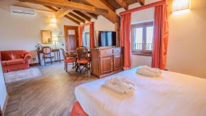 Postel nebo postele na pokoji v ubytování Relais Corte Cavalli