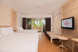 Postel nebo postele na pokoji v ubytování Phuket Orchid Resort and Spa