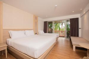 Postel nebo postele na pokoji v ubytování Phuket Orchid Resort and Spa