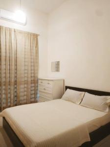 Postel nebo postele na pokoji v ubytování Setia Homestay Chemor Setia