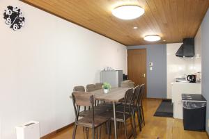 a dining room with a table and chairs at Hotel Relation in 門司港 in Kitakyushu