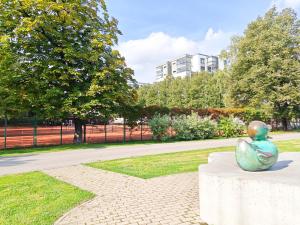 a statue of a frog sitting on a table in a park at Elite centre, free parking, ultra-desirable 1 of 1, lux view in Rīga