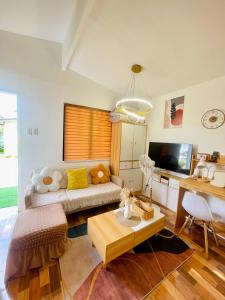 a living room with a couch and a table at S&E-3 Tiny Guest House - Olango Island in Lapu Lapu City