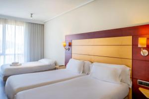 A bed or beds in a room at Abba Garden