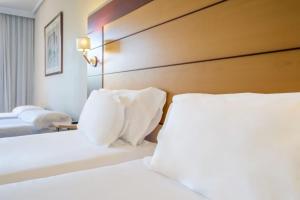 A bed or beds in a room at Abba Garden