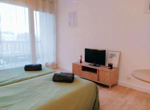 Postel nebo postele na pokoji v ubytování Location pour curistes à Dax - résidence thermale Borda + 5 fotografií