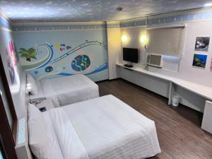 TV a/nebo společenská místnost v ubytování Tapeng Bay Holiday Hotel