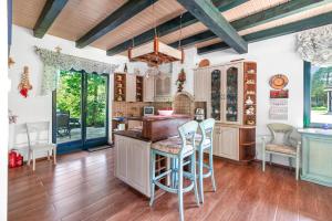 a kitchen with wooden floors and a wooden ceiling at Willa SASINO in Sasino +30 photos