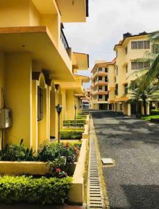 an empty street in front of a building at 2 BHK Luxury Apartment in Thivim Goa in Tivim