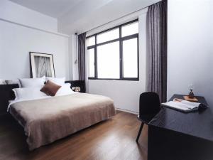 Postel nebo postele na pokoji v ubytování base-PUSAN Serviced Apartment -Shanghai New International Expo Centre
