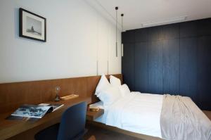 Postel nebo postele na pokoji v ubytování base-PUSAN Serviced Apartment -Shanghai New International Expo Centre