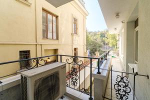 a balcony of a building with a fireplace at Noviz Hotel in Plovdiv