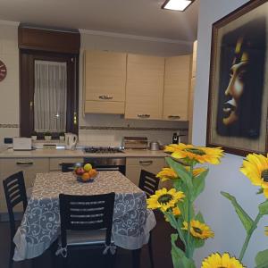 A kitchen or kitchenette at NSM Casa di Fulmine attico con box privato