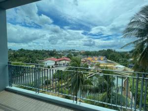 a balcony with a view of a city at Lamoon Trang in Ban Phlu Phli