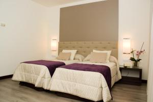 Postel nebo postele na pokoji v ubytování Hotel Complejo París