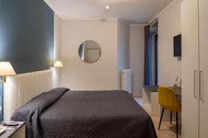 Postel nebo postele na pokoji v ubytování Hotel Romagna