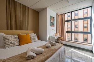 Posteľ alebo postele v izbe v ubytovaní Apartamento El Dorado cerca del mar